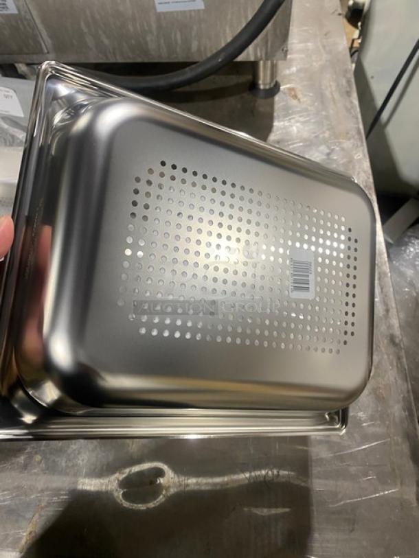 New Vollrath Super Pan-3 1/2-size 2-1/2" deep perforated stainless steel hotel pan, model 90223. Anti-jam feature.