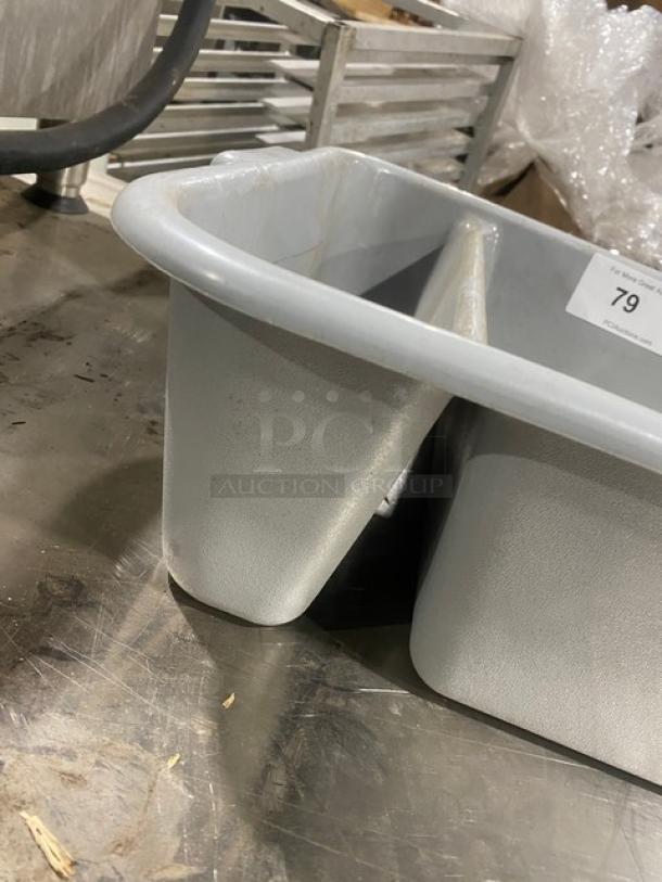 Commercial soft gray divided bus tub with sturdy construction. Features two compartments. Item label marked "79."
