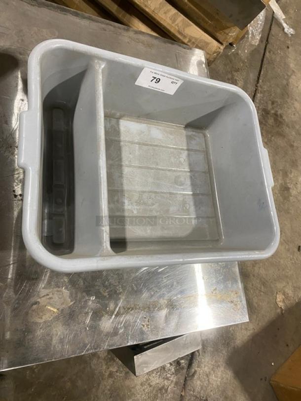 Soft gray divided bus tub in used condition, features two compartments and side handles. Auction tag marked "79".