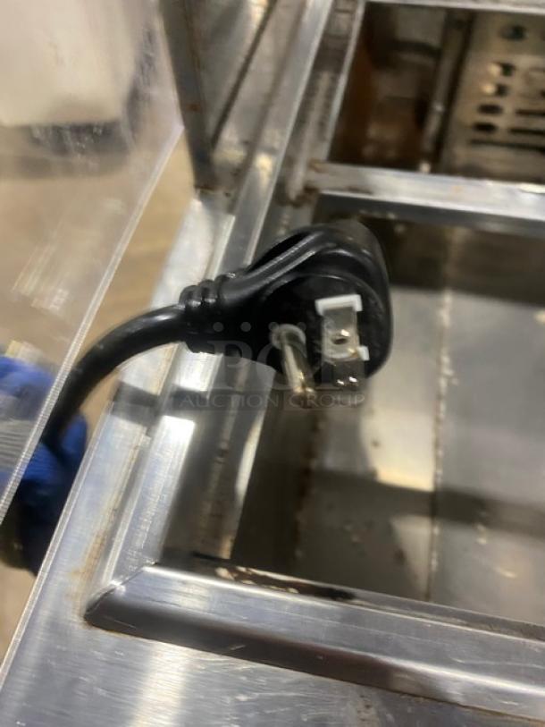 Turbo Air MST-28-N-711S refrigerated prep table power cord detail, stainless steel, single door, 115V, with sneeze guard.