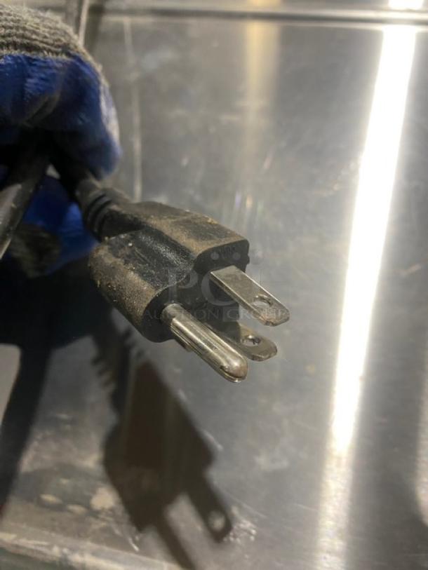 Electric plug for Digi SM5000 retail scale, displaying standard three-prong connector; appears in used condition.