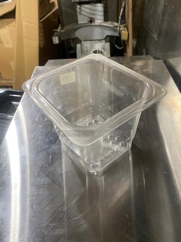 Cambro Camwear Series clear polycarbonate colander, Model 65CLRCW, in new condition, with visible drainage holes.