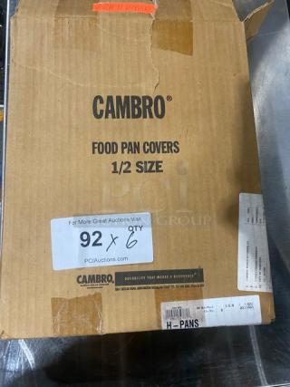 Cambro amber high heat 1/2-size food pan covers, new in box. Box label: "CAMBRO FOOD PAN COVERS 1/2 SIZE." 92x6 quantity.
