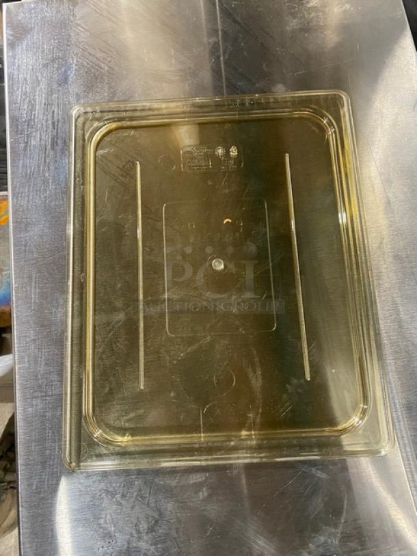 NEW Cambro amber high heat food pan lid, 1/2-size, durable construction. Perfect condition, ideal for commercial use.