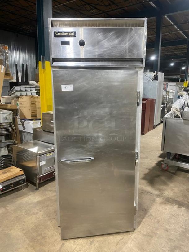 Continental Commercial Stainless Steel Single Door Reach-In Warmer, solid door, brushed finish, well-maintained condition, model label visible.
