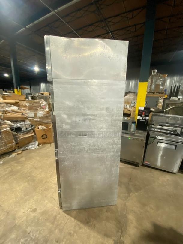 Continental commercial stainless steel reach-in warmer, solid single door, industrial setting, good condition.