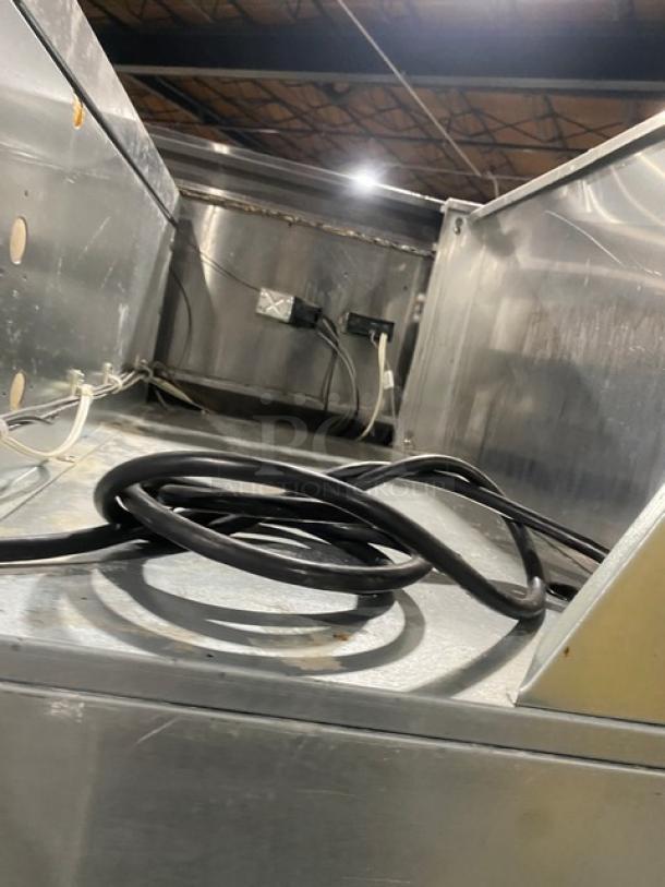 Continental Commercial Stainless Steel Single Door Reach-In Warmer, visible interior wiring, sturdy construction, used condition.