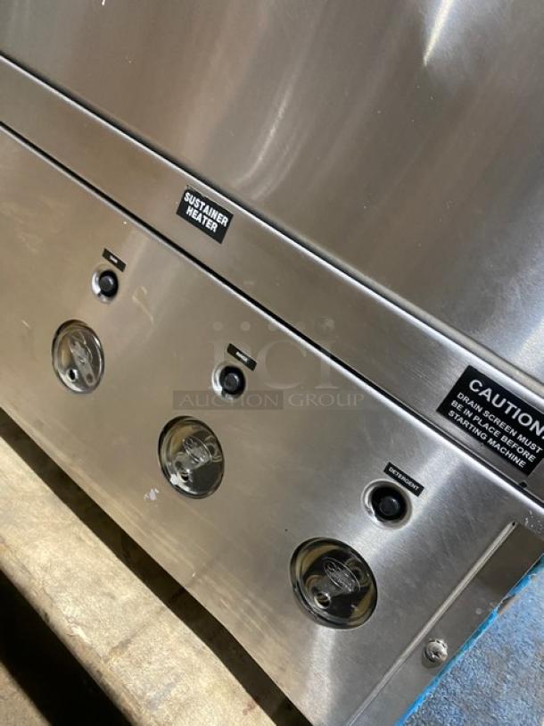CMA Energy-Mizer Series stainless steel undercounter dishwasher, Model L-1X16, features visible heater label and caution sticker.