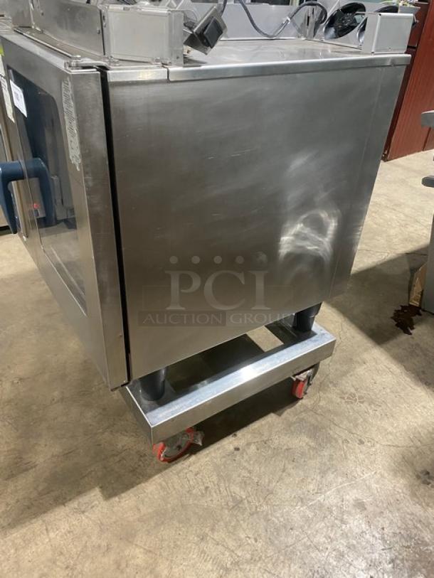 Rational Self Cooking Center 5Senses Combi Oven, stainless steel, natural gas, Energy Star, built-in pan slides, on dolly with casters.