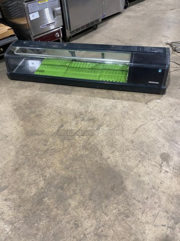 Hoshizaki HNC-150AA-R 60" black curved glass refrigerated sushi display, rear access sliding doors, 115V, used condition.