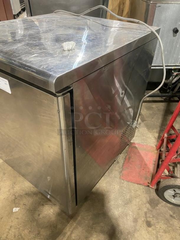 True TUF-28SD stainless steel undercounter freezer, single door, poly coated rack, 115V, on casters, commercial use.