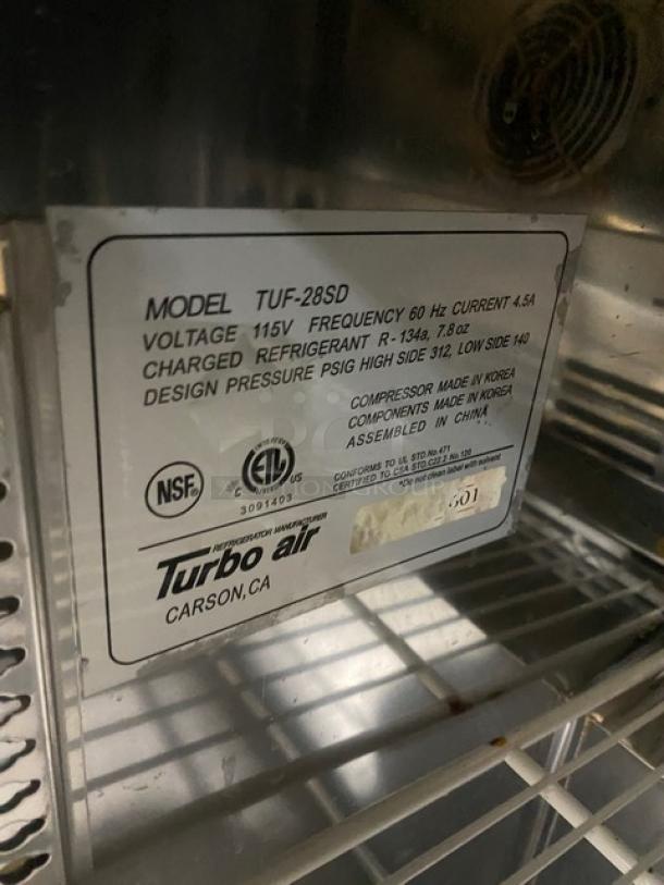 True TUF-28SD stainless steel single door undercounter freezer; includes poly coated wire rack, 115V, on casters.