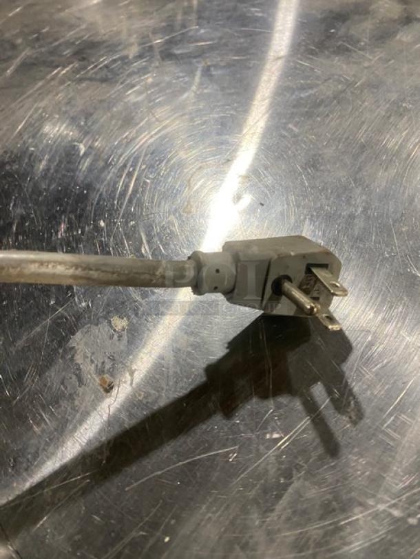 True TUF-28SD single door worktop freezer, stainless steel, with poly-coated rack, 115V, on casters, commercial use.