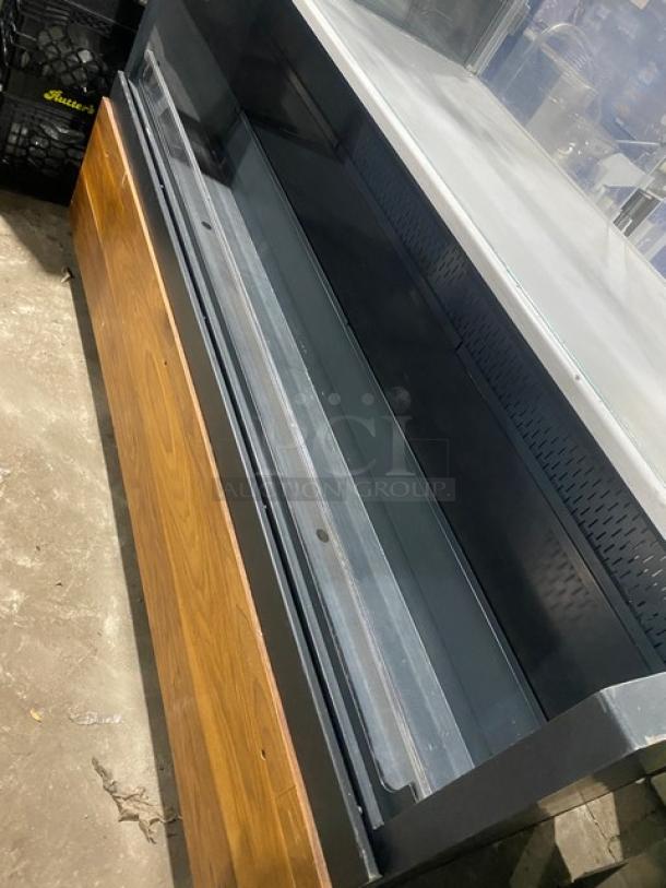 Structural Concepts SBZ6652DR refrigerated black grab-n-go display case with glass showcase, rear sliding doors, on legs.