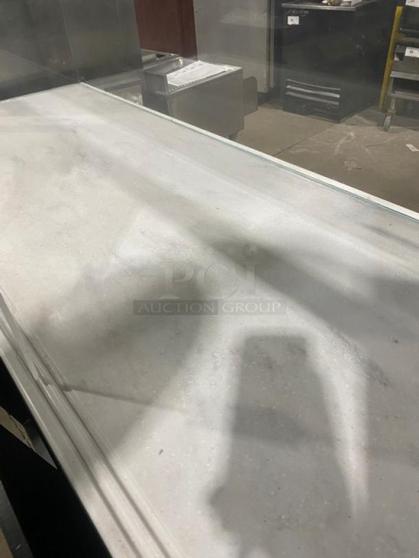 Structural Concepts commercial refrigerated display case, model SBZ6652DR, black finish, enclosed top glass, rear sliding doors.