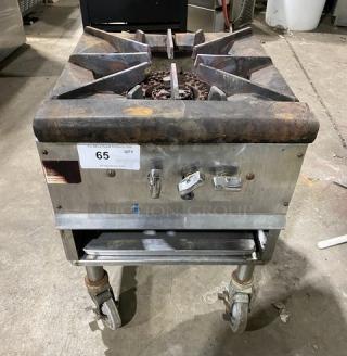 Commercial stainless steel gas-powered single burner stock pot range on casters, visible wear, item number 65.