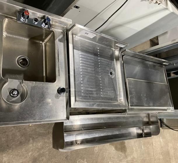 NBR Equipment stainless steel cocktail station with cup washing sink, drain board, sliding top ice bin, and double speed rail. Model: IB-2418/UW-1-1012-1521-TDV.