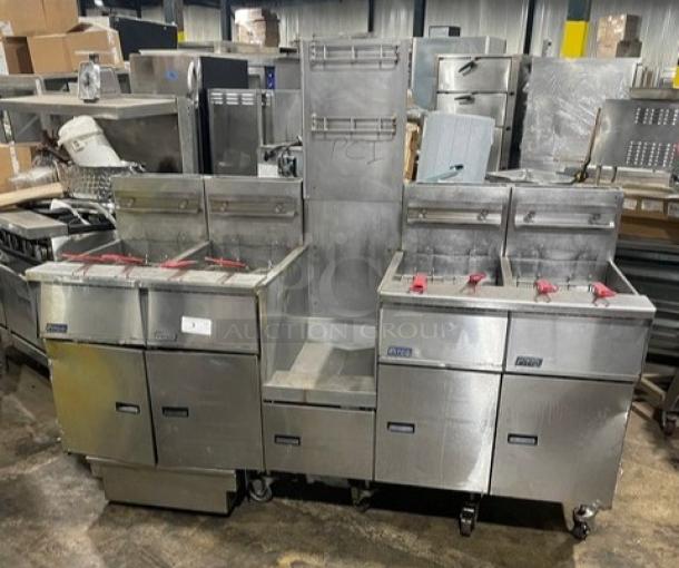 Pitco FG-SGH50 4-bay 50 lb. stainless steel gas fryer, center basket hanger, backsplash, casters; used, good condition.