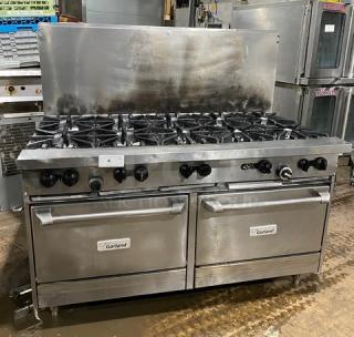 Garland commercial stainless steel gas 10-burner range with double oven, backsplash, and wired rack, on sturdy legs.