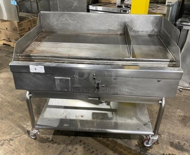 WoodStone stainless steel natural gas countertop plancha griddle with back and side splash, single undershelf cart on casters.