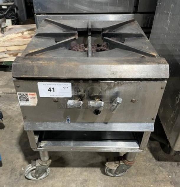 Commercial stainless steel gas single burner stock pot range on casters, with adjustable controls. Some surface wear visible.