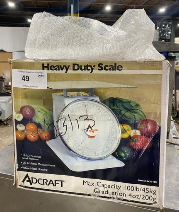 Adcraft SCA100 commercial 100 lb. portion control scale, new in box, with 13.5" stainless steel platform and metal housing.