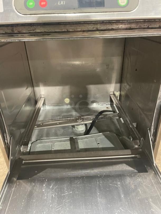 Hobart LXI Series stainless steel undercounter dishwasher, energy-efficient, clean interior, visible control panel, on legs.