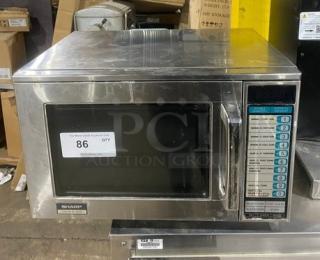 Sharp R22GTF commercial stainless steel countertop microwave oven with digital control, model SN: 109550, 120V, in used condition.