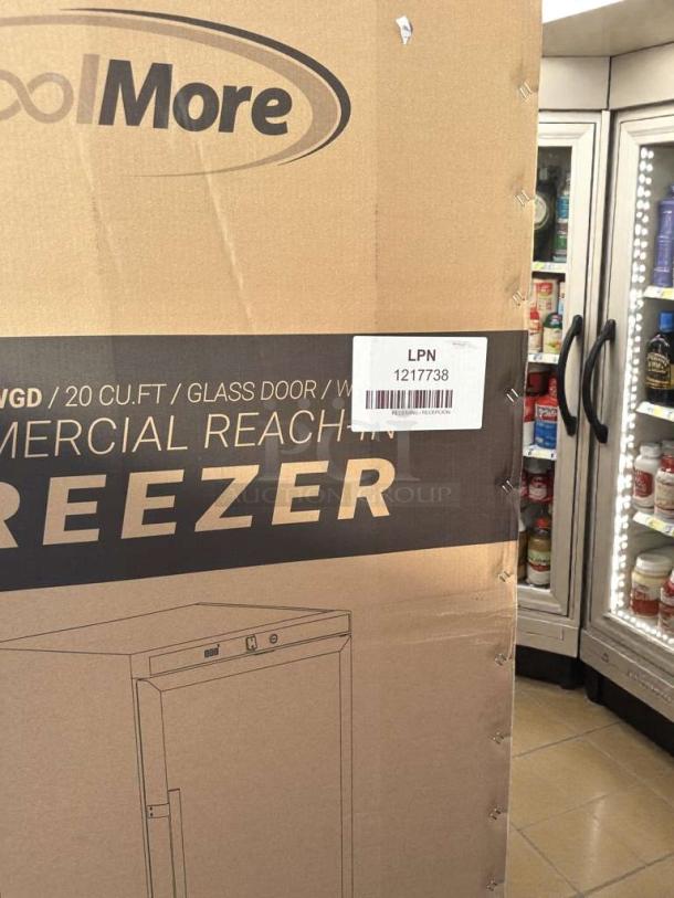 Koolmore Commercial Reach-In Freezer, model KM-FMD20WGD, new with minor cosmetic damage. 20 cu.ft., glass door. Box shows model illustration and label LPN 1217738.