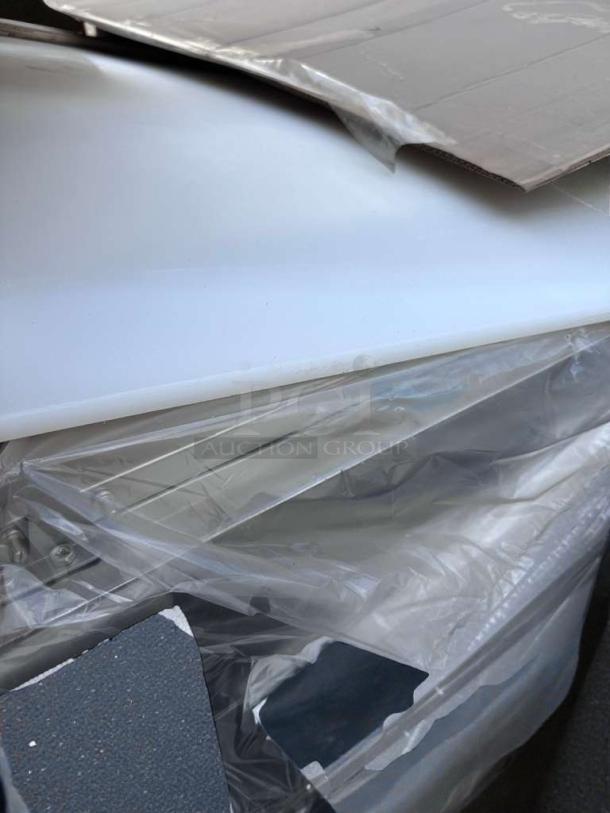 Brand new Koolmore 72" refrigerated pizza prep fridge, model KM-RPPS-3DSS, shown with scratch and dent packaging.