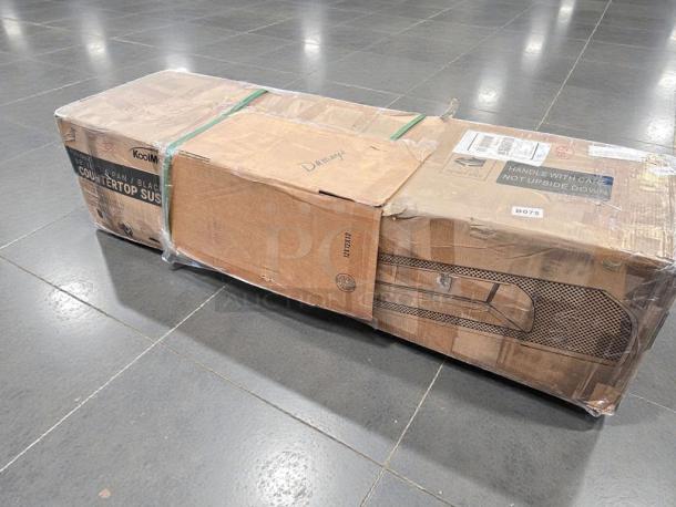 Damaged Koolmore 60" Sushi Countertop Display Refrigerator, Model KM-SR60-BK, in original packaging. Marks indicate heavy wear.