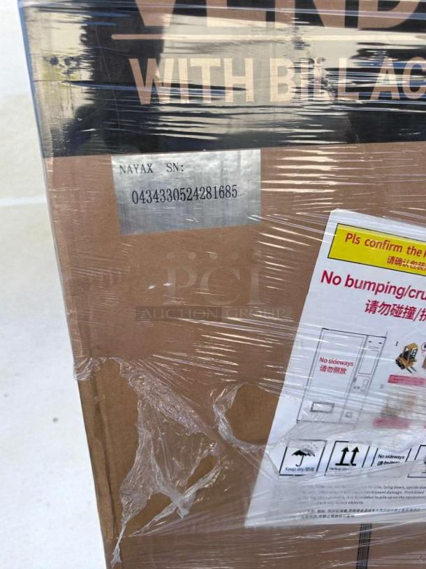 Brand new Koolmore refrigerated snack vending machine, model KM-VMR-30-BR, with scratch and dent. Serial: 0434330524281685.