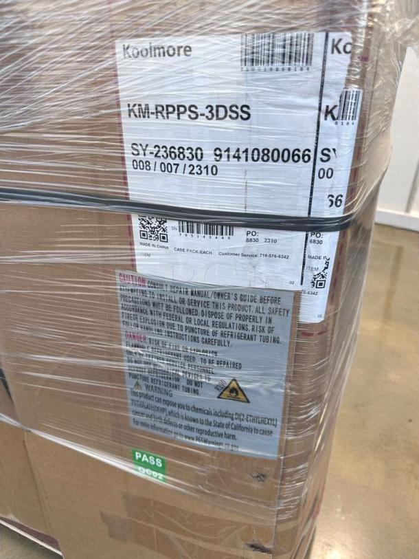 Brand new Koolmore 92" three-door pizza prep refrigerator, model KM-RPPS-3DSS, labeled in packaging. Some scratches and dents.