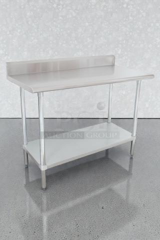 Advance Tabco stainless steel work table, KLAG-304-X model, brand new with minor scratches, features a backsplash and lower shelf.