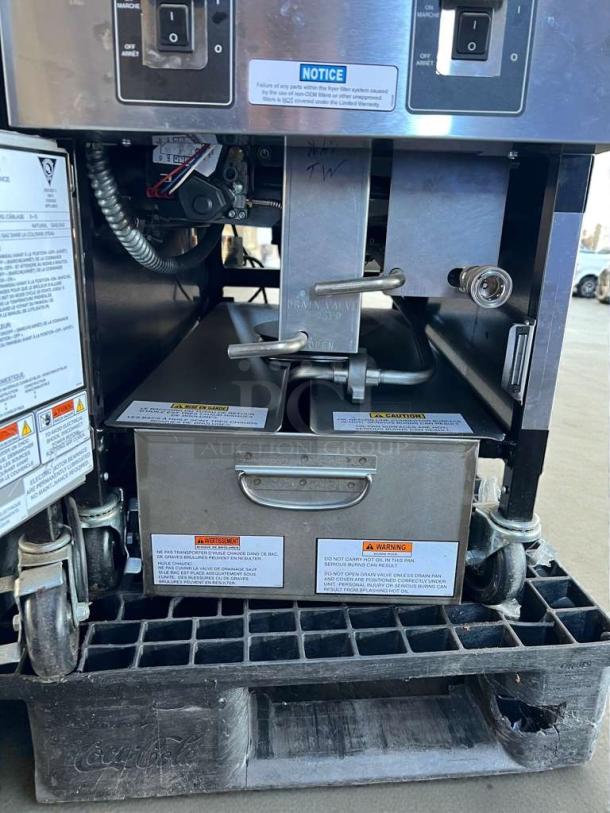 Henny Penny OFG-321 natural gas open fryer in exceptional condition, featuring Computron 1000 controls and sturdy caster wheels.