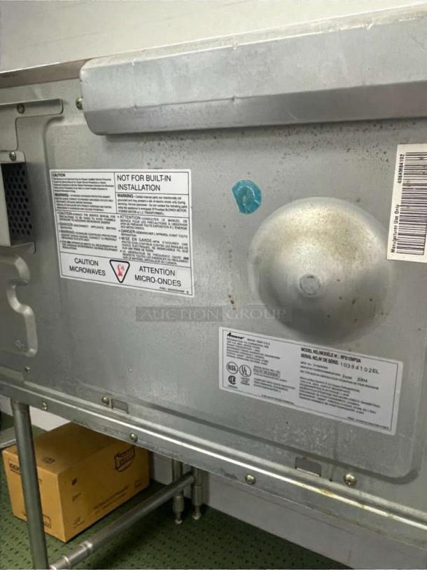 Amana Commercial Microwave RMS18TS, outstanding condition, 120V, tested and working. Labels show model and safety info.