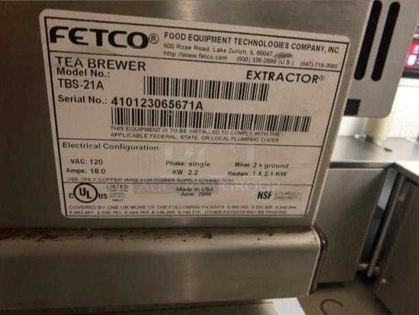 Pristine FETCO TBS-21A Commercial Tea Brewer, 120V, single phase, fully tested. Label shows model, serial, and electrical specs.