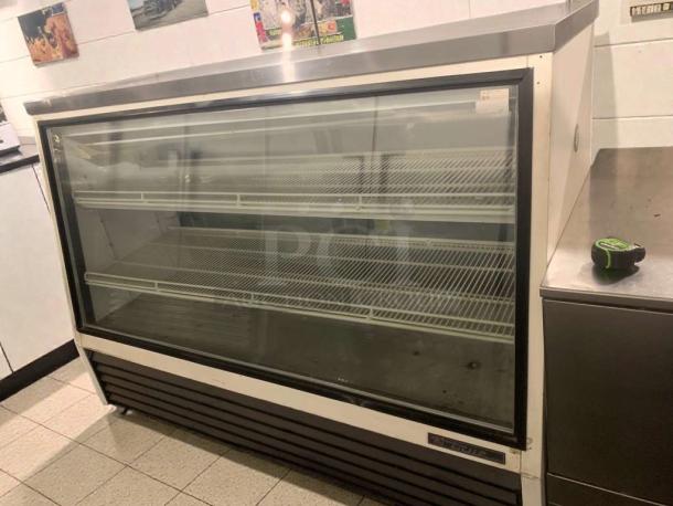 True glass door refrigerated display merchandiser, commercial model, excellent condition, 115V, shelves visible, tested working.