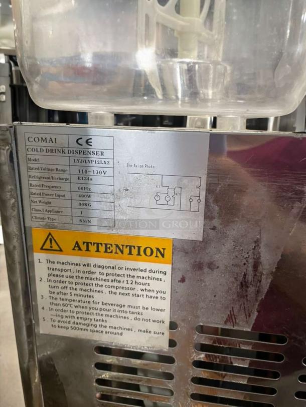 COMAI commercial cold drink dispenser, model LYJ-JY/P12LX2, in superb condition. Features two tanks and 110V operation. Visible labels indicate electrical specifications and usage instructions. Fully tested and working.