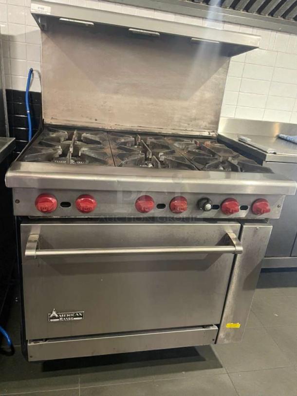 American Range commercial gas range with 6 burners and oven, premium condition, fully tested, model AMR-L-RNG-0097.
