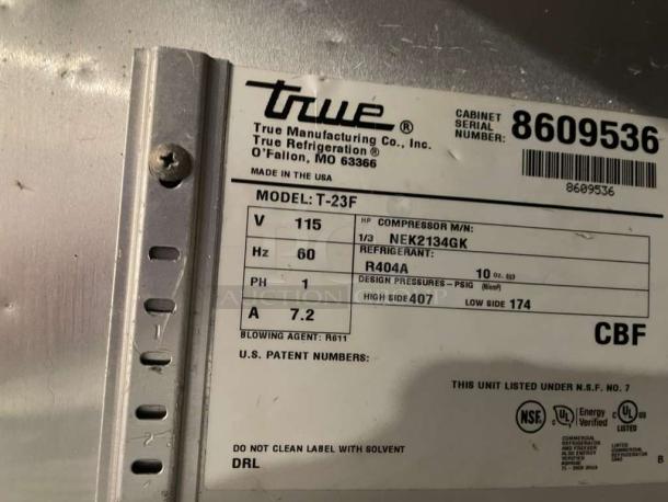 High-grade True T-23F commercial freezer label, showing model, voltage (115V), single phase, refrigerant R404A, and NSF certification.