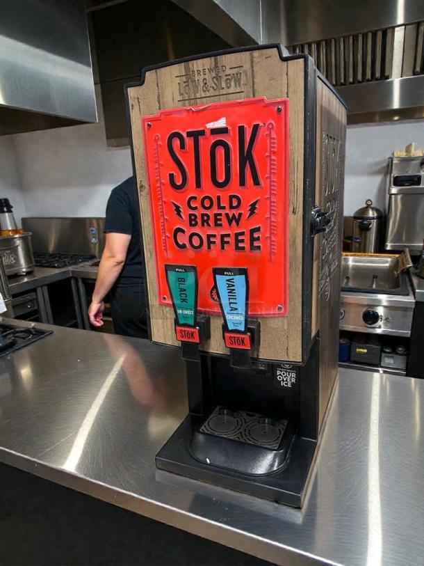 Outstanding condition STōK Cold Brew Coffee Dispenser, 110V, Creamiser Model 230. Features dual spouts for Black and Vanilla brew.