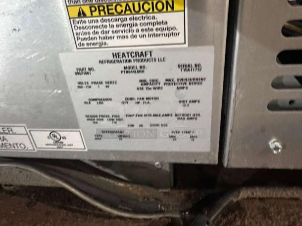 Heatcraft PRO3 condensing unit, high-grade condition, 115V, fully tested. Labels detail model HTC-L_PRO3-0121 specs and safety info.