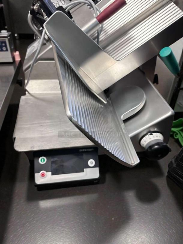 Bizerba GSP HD IW-90 GCB commercial meat slicer in exceptional condition, featuring semi-automatic operation and digital controls.