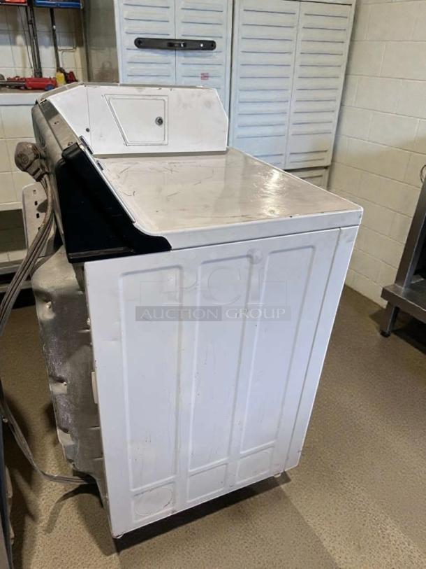 Immaculate GE coin-operated dryer model DCCD330ED2WC, 120/208–240V, good condition, fully tested and working.