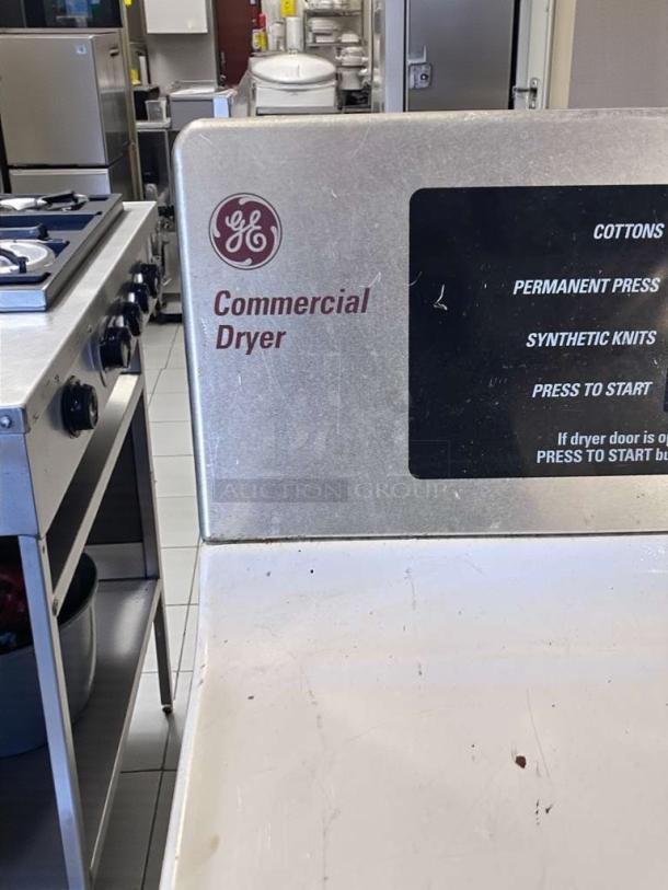 Immaculate GE Commercial Coin-Operated Dryer, Model DCCD330ED2WC. Clear controls for various fabric settings.