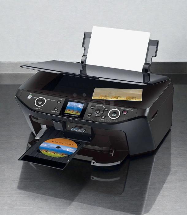 Epson Stylus Photo RX595 Inkjet Printer, all-in-one, pristine condition, tested and working, prints photos and CDs.