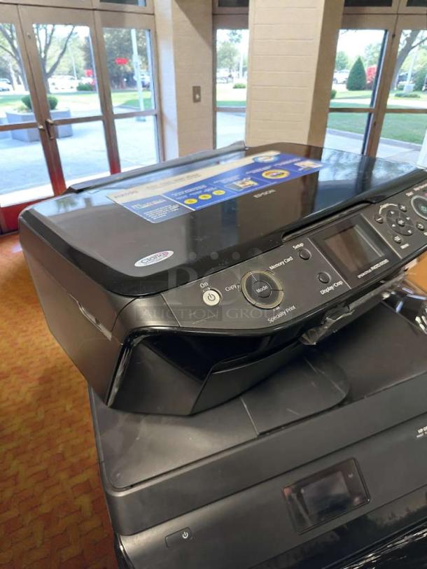 Pristine Epson Stylus Photo RX595 inkjet printer, fully tested, working, sleek black design with control panel, Epson logo visible.