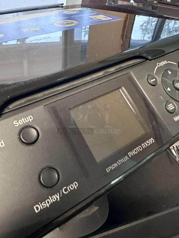 Epson Stylus Photo RX595 All-in-One Inkjet Printer in pristine condition, featuring a control panel with display.