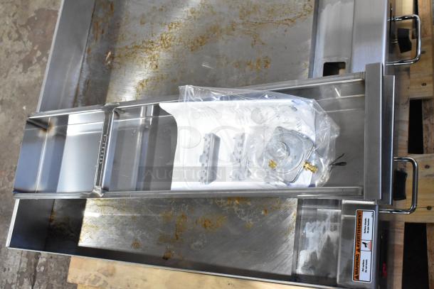 Brand new Wolf AGM60-101 countertop griddle, stainless steel, 60", natural gas, 135,000 BTU, minor scratches.